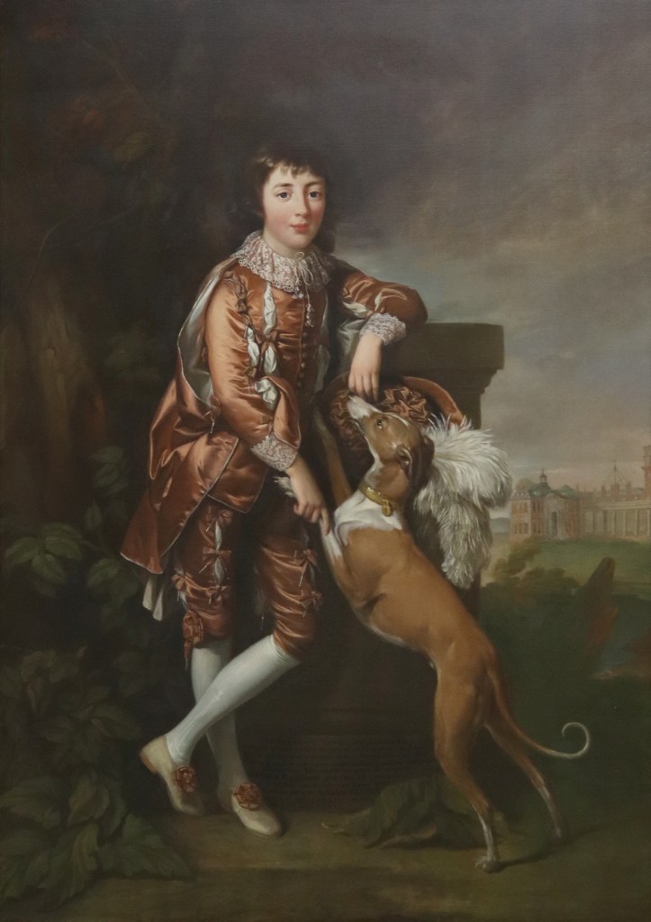 Portrait of Frederick Blomberg painted by court artist Richard Brompton in about 1770. Frederick wears a fabulous rust-coloured outfit and is with a greyhound. In the background the building is Buckingham House before it was remodelled and turned into a palace.